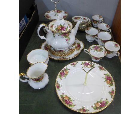 A collection of Royal Albert Old Country Roses china including a teapot, cake plate, side plates, milk jug, sugar, etc. 