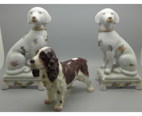 A pair of reproduction continental dogs and a model of a spaniel 
