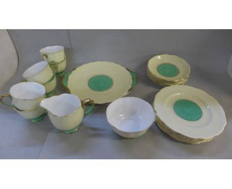 A Royal Albert green and cream china tea service comprising six cups and saucers, a sugar bowl, milk jug, etc. 