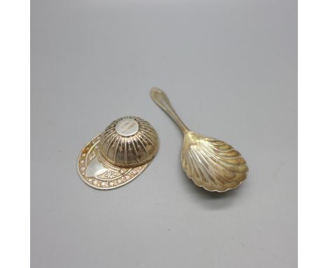 A silver jockey cap caddy spoon and one other silver caddy spoon 