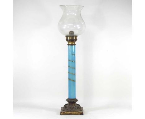 A large 19th century brass candle lamp, with an opaque blue spiral column, with a brass collar, on a relief decorated base, s