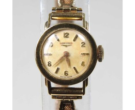 A 1960's Longines 9 carat gold ladies wristwatch, the signed 18mm dial with baton and Arabic hours, the case numbered 7122, o