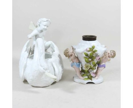 A Meissen style swan centrepiece, 32cm long, together with a continental figural oil lamp (2)