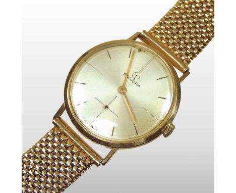 A 1970's Rodania 9 carat gold cased gentleman's wristwatch, the signed 30mm dial with baton hours, on a 9 carat gold bracelet