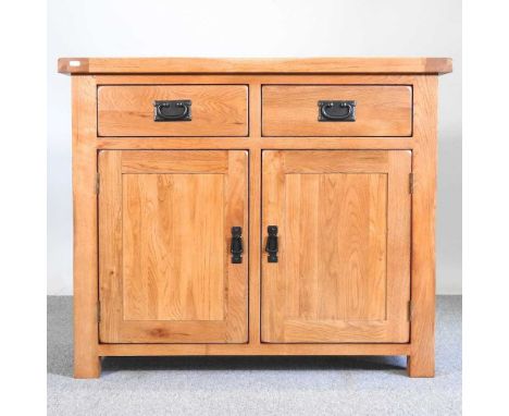 A modern light oak sideboard, with drawers and cupboards below100w x 43d x 83h cm