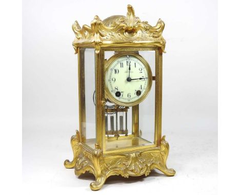 A 19th century brass cased four glass mantel clock, the white enamel dial with Arabic hours, signed Seth Thomas, with a mercu