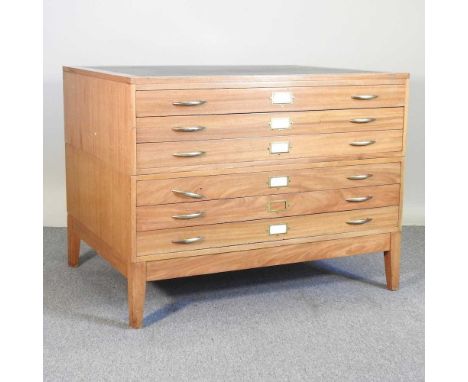 A mid 20th century plan chest, containing six long drawers, in two sections, on stand, with a green inset top116w x 90d x 89h