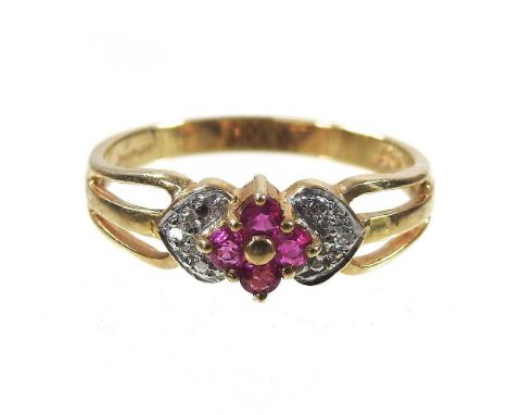 A 9 carat gold diamond and ruby cluster ring, size L/M, 1.8g, boxed