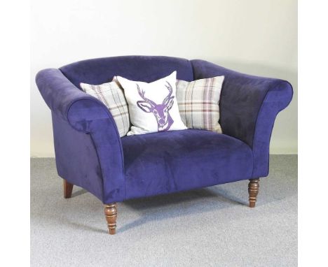 A blue upholstered sofa, on turned legs140w x 95d x 90h cm