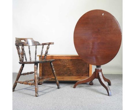 A mid 20th century carved oak blanket box, together with a captain's chair and a 19th century tripod table (3)
