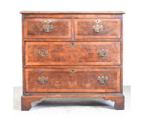 A reproduction walnut and crossbanded chest of drawers, on bracket feet84w x 50d x 81h cm