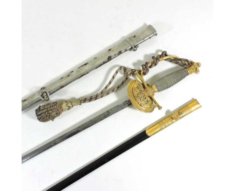 A Victorian Court sword, having a wire bound grip, with coronet hilt and shell guard with VR monogram, the etched steel blade