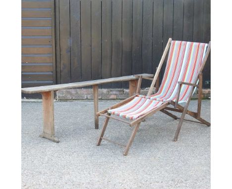A rustic pine bench, together with a deck chair (2)