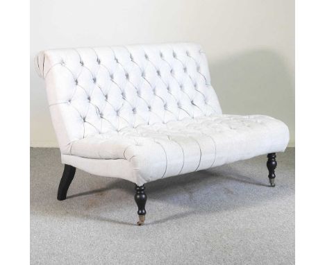 A modern button backed upholstered two seater sofa, on turned legs130w x 90d x 95h cm