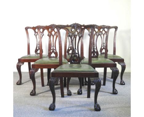 A set of six early 20th century mahogany dining chairs, of Chippendale design, with green padded seats (6)