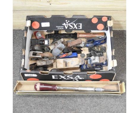 A collection of woodworking planes and hand tools