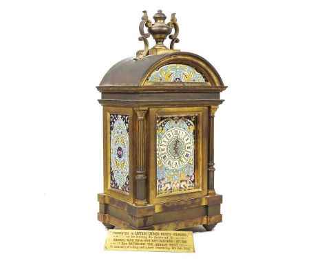 A 19th century French brass and champleve enamel cased mantel clock, the arched case, surmounted by an urn finial, the dial w