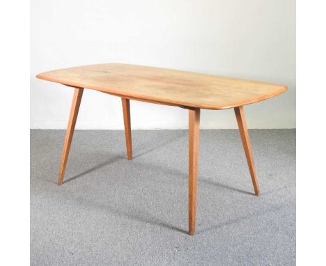 A 1970's Ercol light elm dining table, on a splayed base157w x 76d x 71h cm