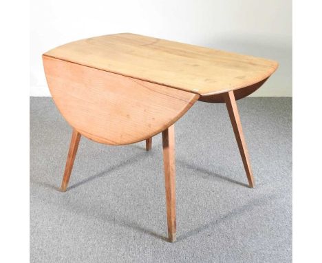 A 1970's Ercol light elm drop leaf dining table, on a splayed base122w x 112d x 71h cm