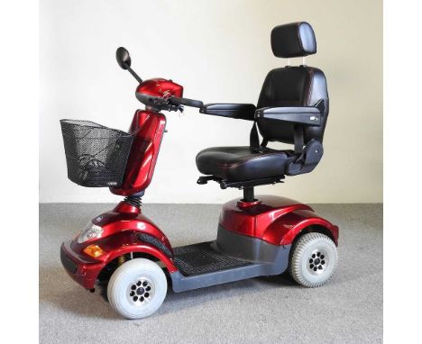 A red TGA electric mobility scooter, 126cm wide, with charger