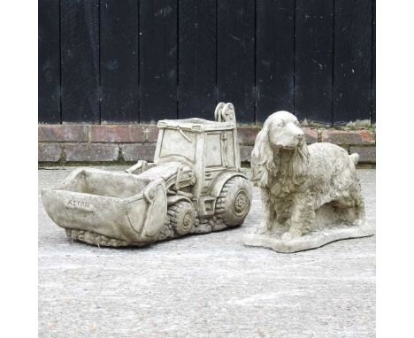 A cast stone garden model of a dog, together with a planter in the shape of a tractor, 70cm wide (2)