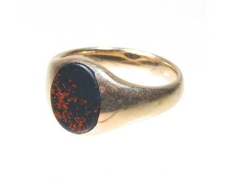 A 9 carat gold signet ring, set with a bloodstone, 7.1g, size RComplete, but dirty with overall light signs of wear. Hallmark