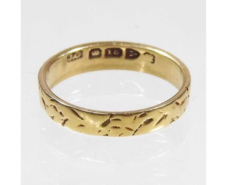 An 18 carat textured gold wedding band, 2.6g, size N