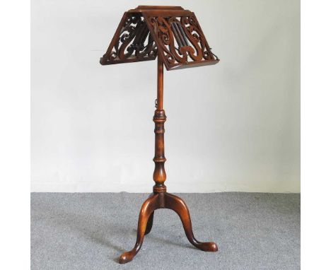 A Victorian style duet music stand, 20th century, with an adjustable top, on a tripod base, 47cm wide