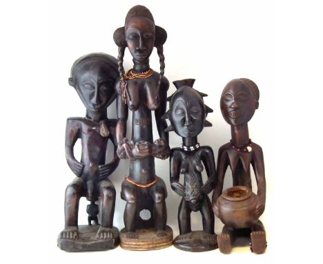 Four Large Luba / Hemba figures, the tallest measures 99cm high.  All lots in this Tribal and African Art Sale are sold subje