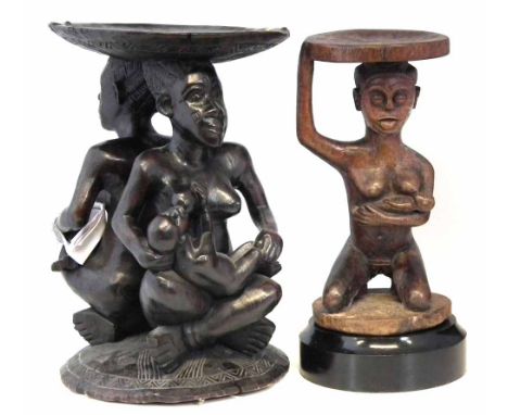 Two Chief's stools, carved with maternity figures, the largest measures 51cm high     All lots in this Tribal and African Art