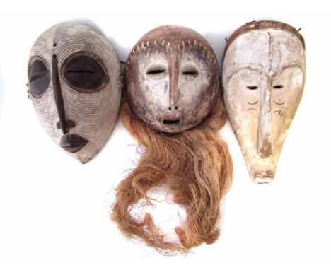 Fang mask, Lega mask, and a Luba mask, the largest measures 34cm high     All lots in this Tribal and African Art Sale are so