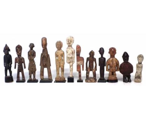 Twelve African figures carved in various tribal styles, the largest measures 23cm high     All lots in this Tribal and Africa