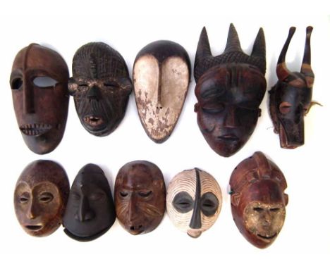Ten African masks carved in various tribal styles, the largest measures 36cm high    All lots in this Tribal and African Art 