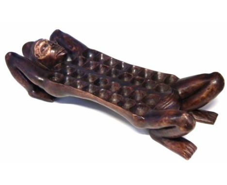 Figural Mancala board, 88cm long      All lots in this Tribal and African Art Sale are sold subject to V.A.T. Therefore £100 