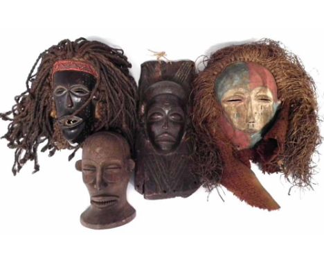 Chokwe panel, mask and two other masks, the panel measures 38cm high     All lots in this Tribal and African Art Sale are sol