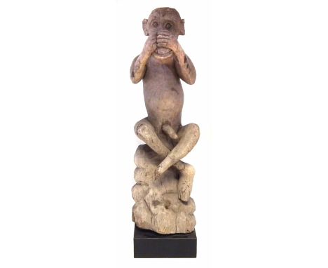 Carved figure of a Monkey covering his nose, 80cm high    All lots in this Tribal and African Art Sale are sold subject to V.