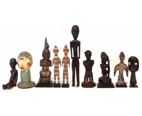 Ten African figures carved in various tribal styles, the largest measures 33cm high     All lots in this Tribal and African A