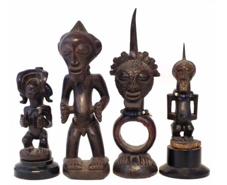 Three Songye figure and a Chokwe figure, the tallest measures 44cm high    All lots in this Tribal and African Art Sale are s