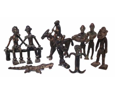 Seven Asante brass gold weight figures, the tallest measures 11cm high     All lots in this Tribal and African Art Sale are s