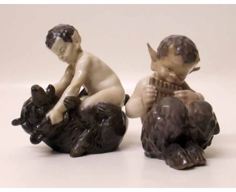 Two Royal Copenhagen fauns, one modelled wresting with a bear and one playing the pipes, models 648 and 1736. Condition repor