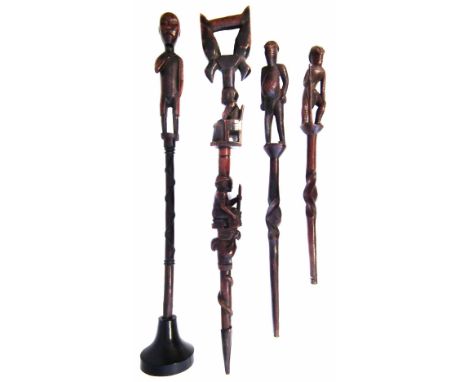 Four ceremonial staffs, one inscribed 'MAPA MbA' the largest measures 93cm high     All lots in this Tribal and African Art S