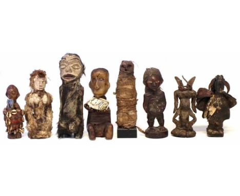 Eight African figures carved in various tribal styles, the largest measures 26cm high     All lots in this Tribal and African