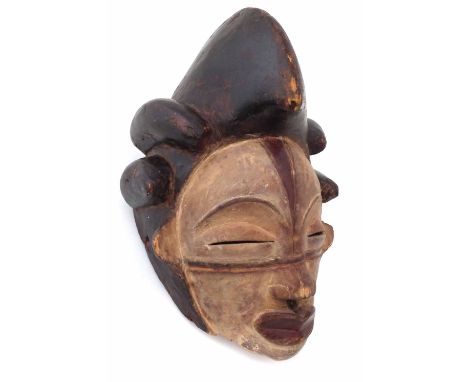 Punu mask, 28cm high     All lots in this Tribal and African Art Sale are sold subject to V.A.T. Therefore £100 hammer price 