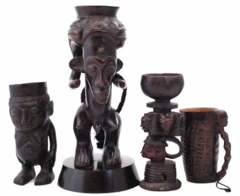 Kuba Anthropomorphic cup, together with three other similar cups, the tallest measures 36cm high       All lots in this Triba