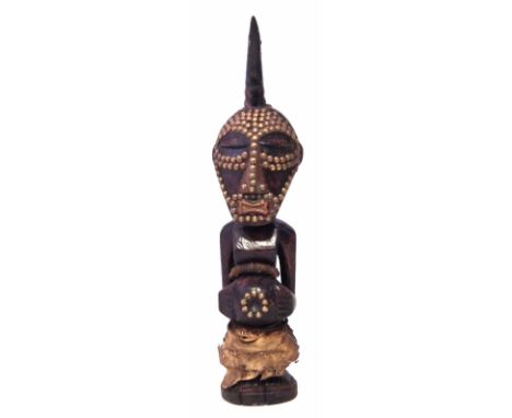 Songye Nkisi Power figure or Fetish, 48cm high     All lots in this Tribal and African Art Sale are sold subject to V.A.T. Th