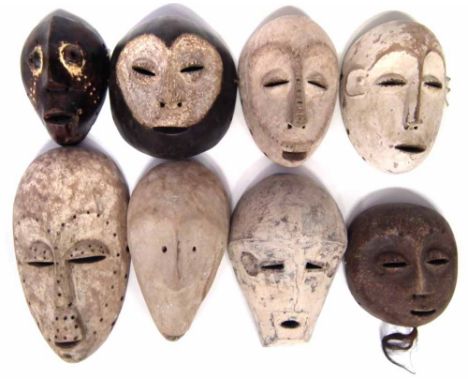 Eight African masks carved in various tribal styles, the largest measures 34cm high    All lots in this Tribal and African Ar