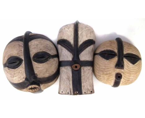 Two Luba masks and a Songye mask, the largest measures 40cm high     All lots in this Tribal and African Art Sale are sold su