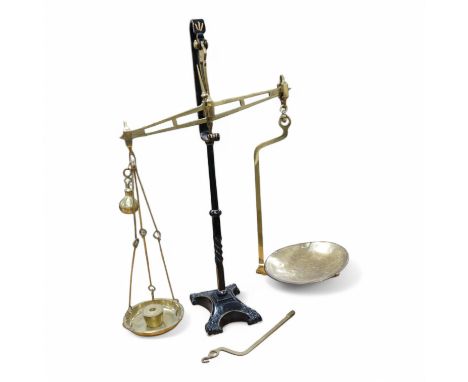 A brass Beam scale, on cast iron stand, W &amp; T Avery, 95cm high. Condition - fair