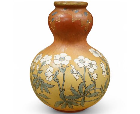 A Mettlach stoneware floral vase, impressed marks, 36cm high. Condition - fair/good