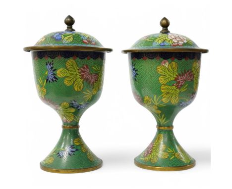 A pair of Chinese champleve enamel floral jars and covers, 22cm high. Condition - good